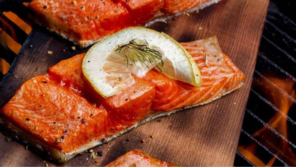 grilled wild caught salmon with a lemon on top